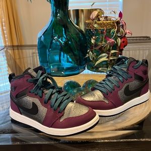 Boys size 1y black burgundy and blue in color Air Jordan’s